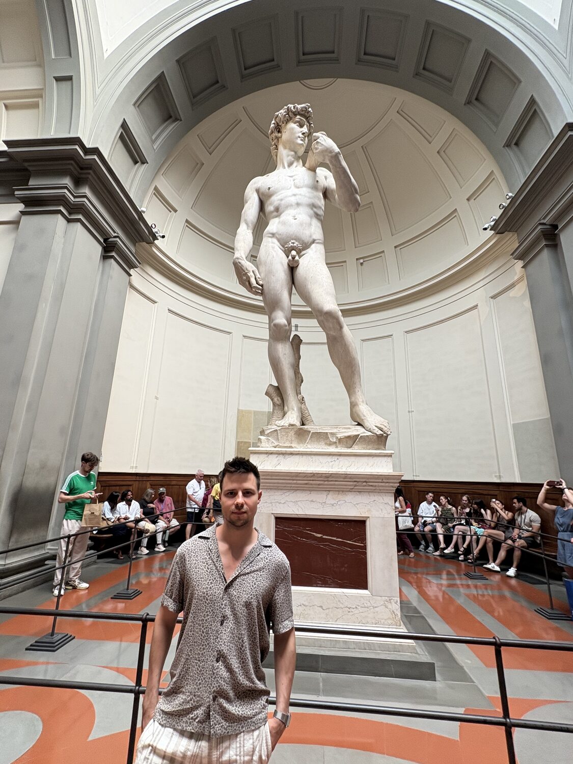 Michael standing beneath Michelangelo's David in the Accademia Gallery