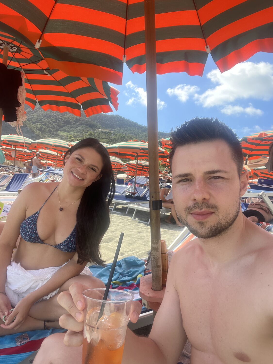 Francis and me beneath the striped umbrellas in Monterosso