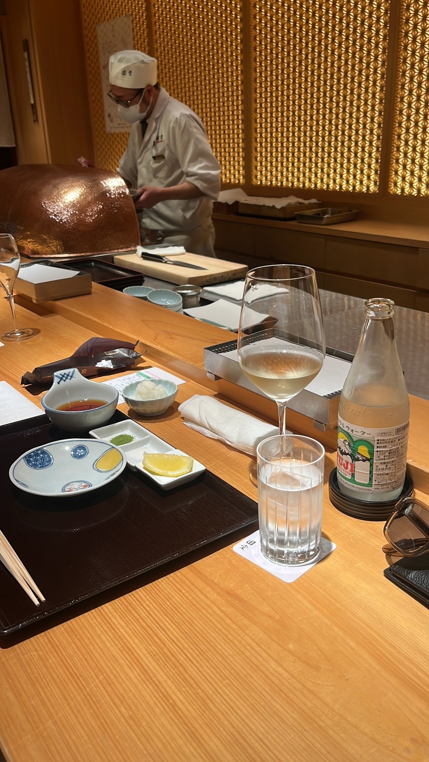 Sushi counter with white wine and sake