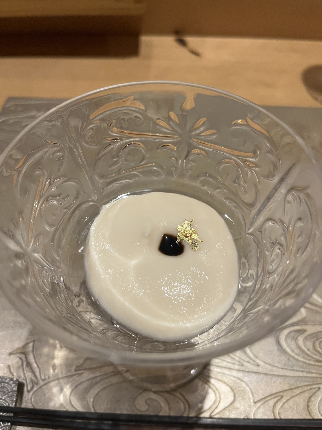 Onion amuse with gold flake