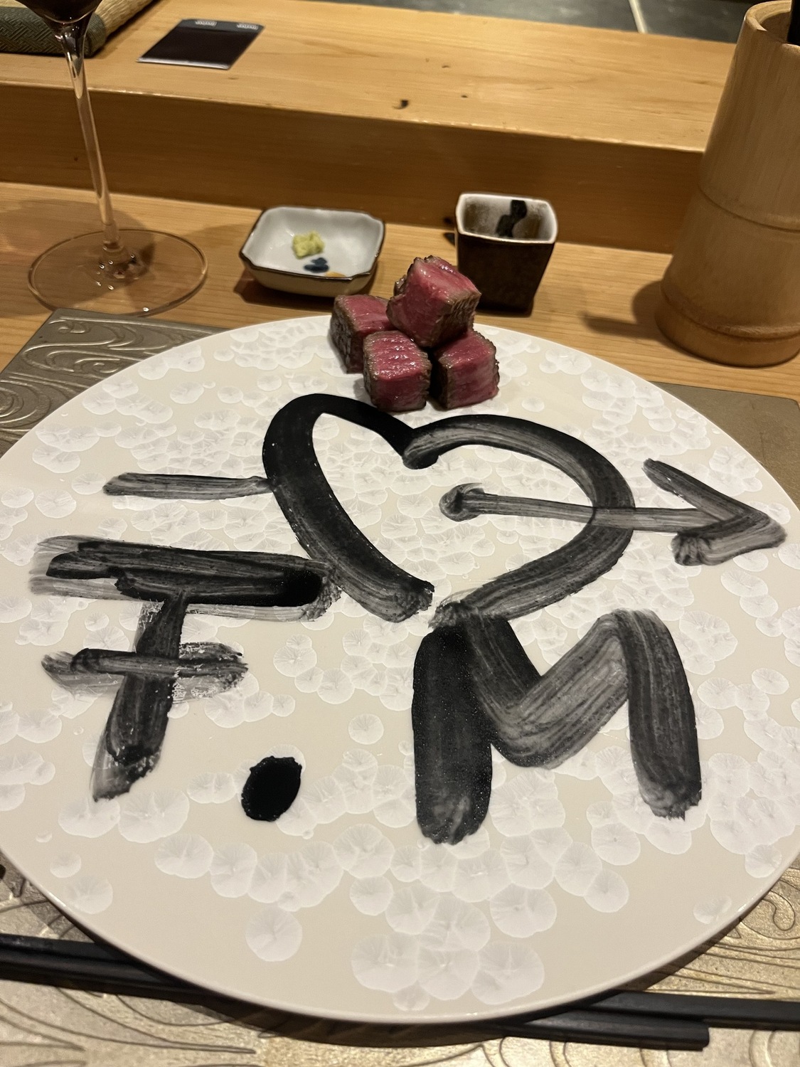 Wagyu cubes on a chef-drawn heart plate