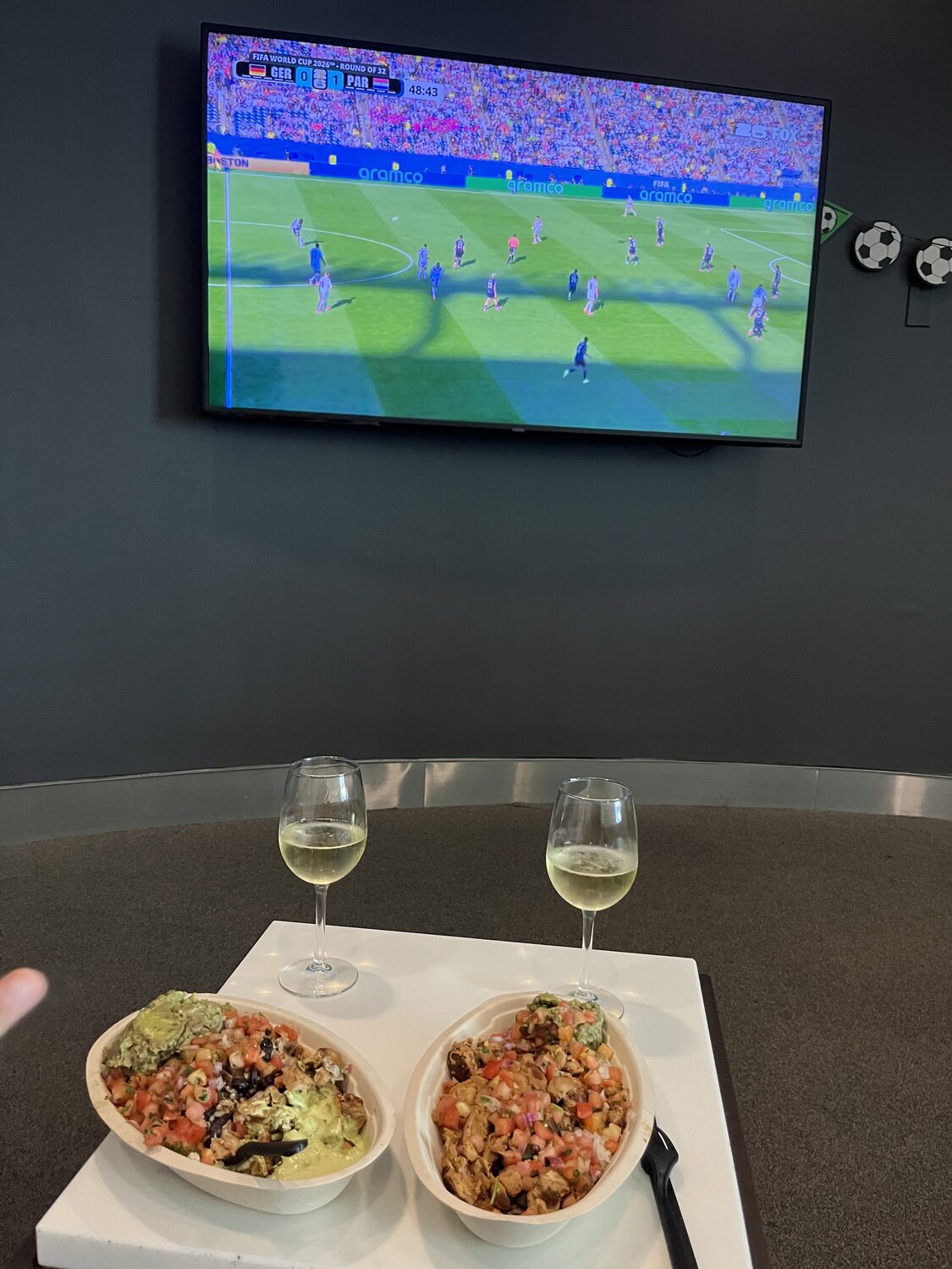 Watching a World Cup broadcast while waiting at JFK