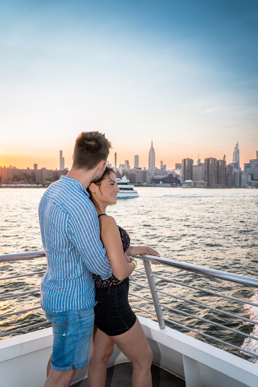 Couple on a New York Harbor cruise with the Midtown skyline
